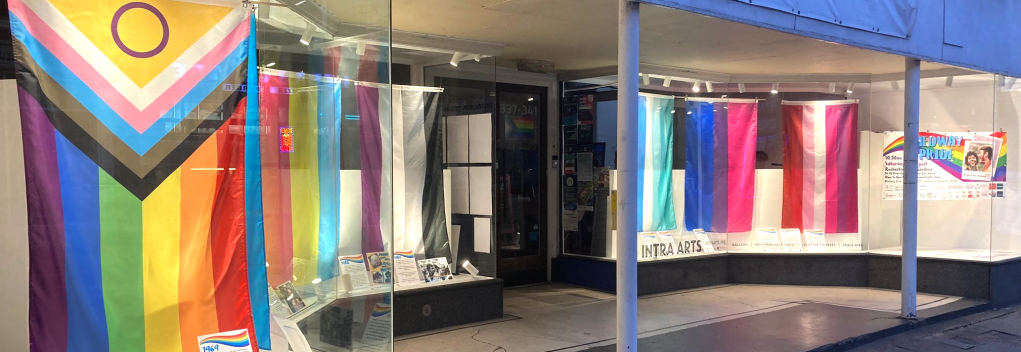 Pride flags in the windows gallery at INTRA for Medway Pride Fringe
